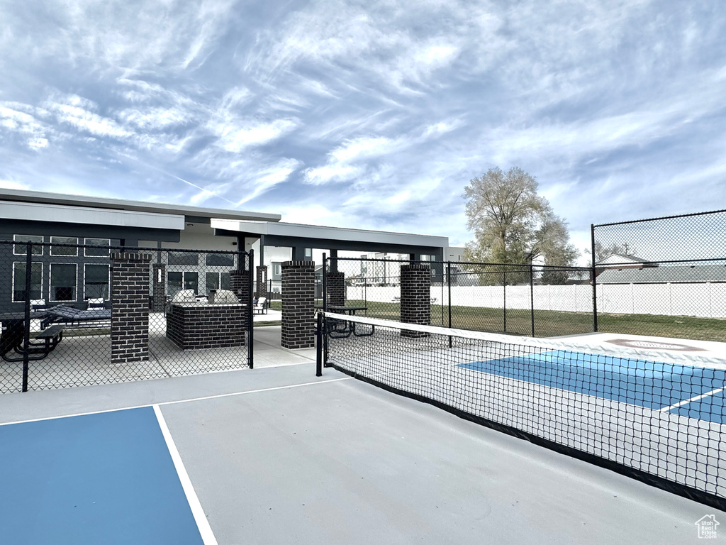 View of basketball court featuring fence