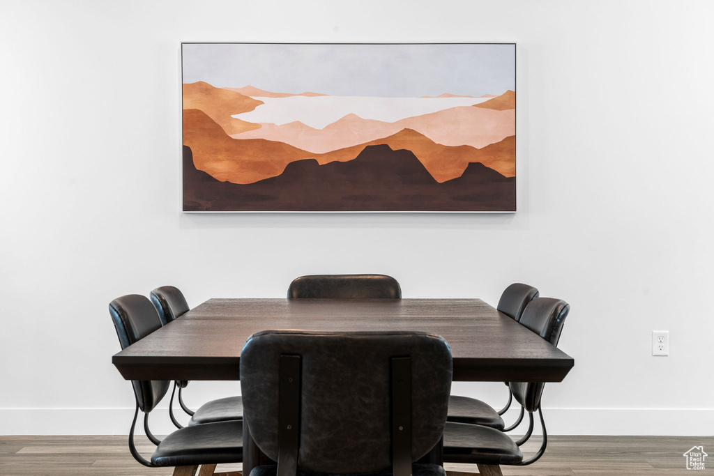 Dining room with baseboards and wood finished floors