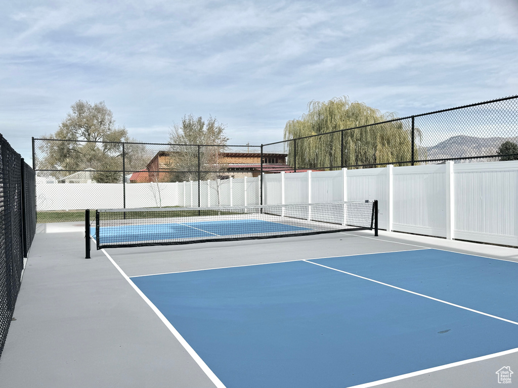 View of tennis court with fence