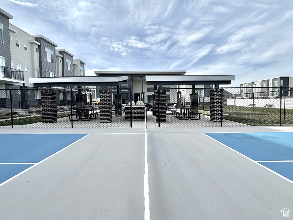 View of parking / parking lot featuring fence