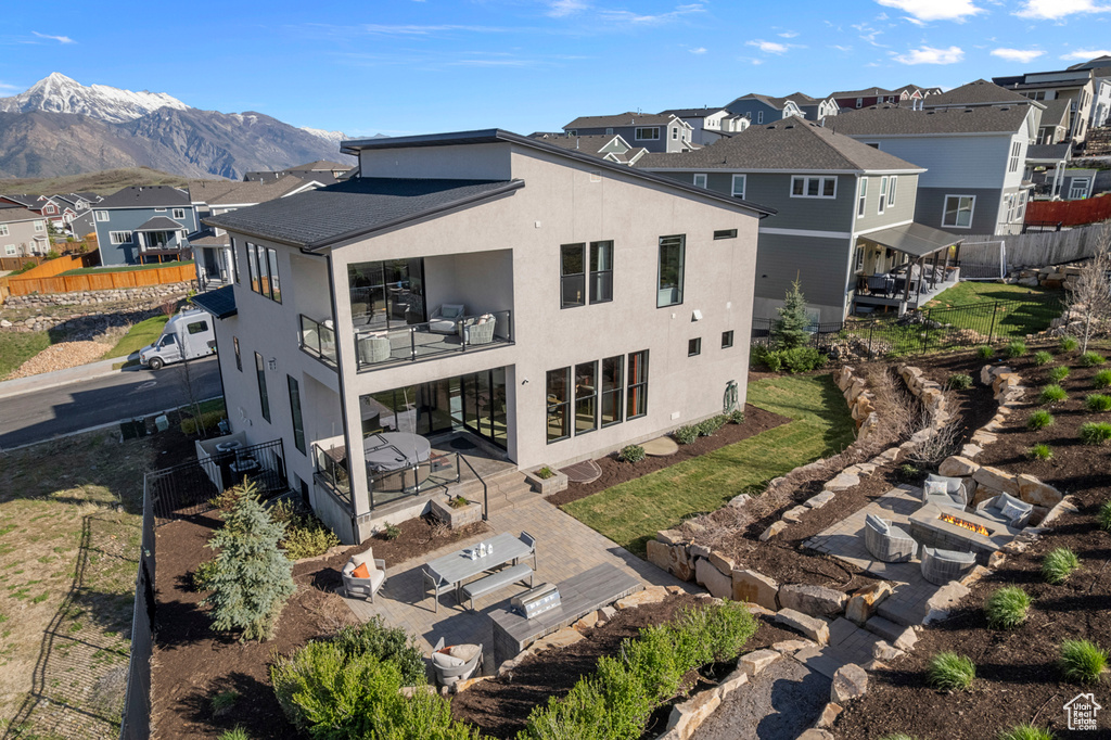 Aerial view of residential area featuring a mountainous background