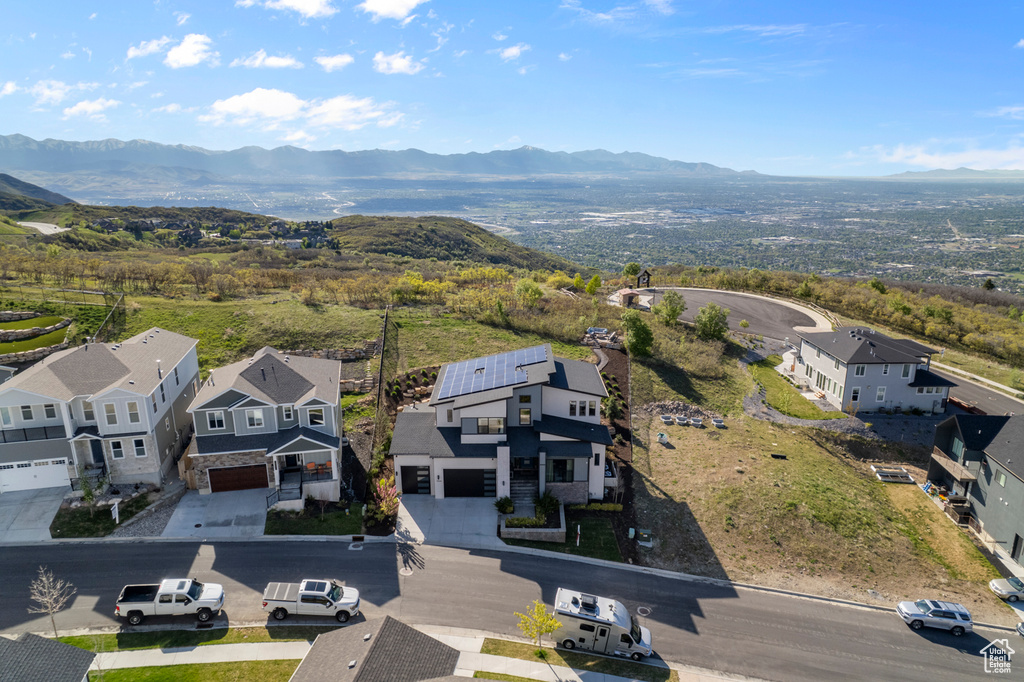 Aerial perspective of suburban area featuring a mountain backdrop