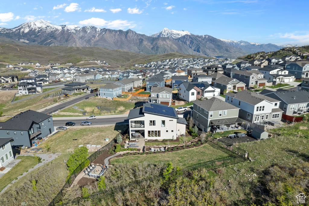 Aerial perspective of suburban area with a mountainous background