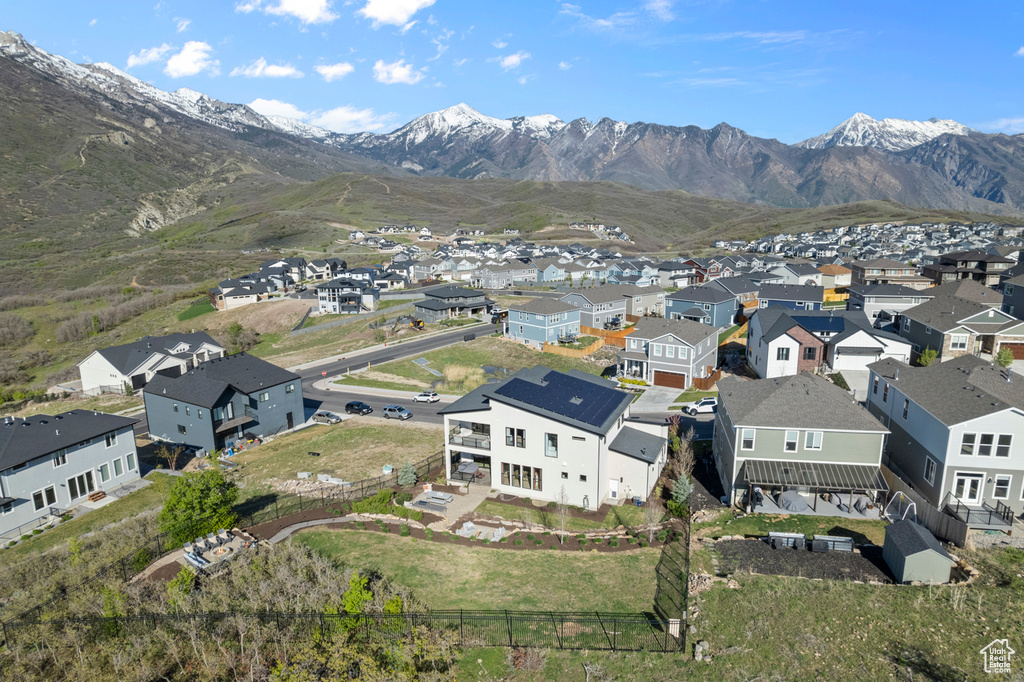 Aerial perspective of suburban area with a mountain backdrop