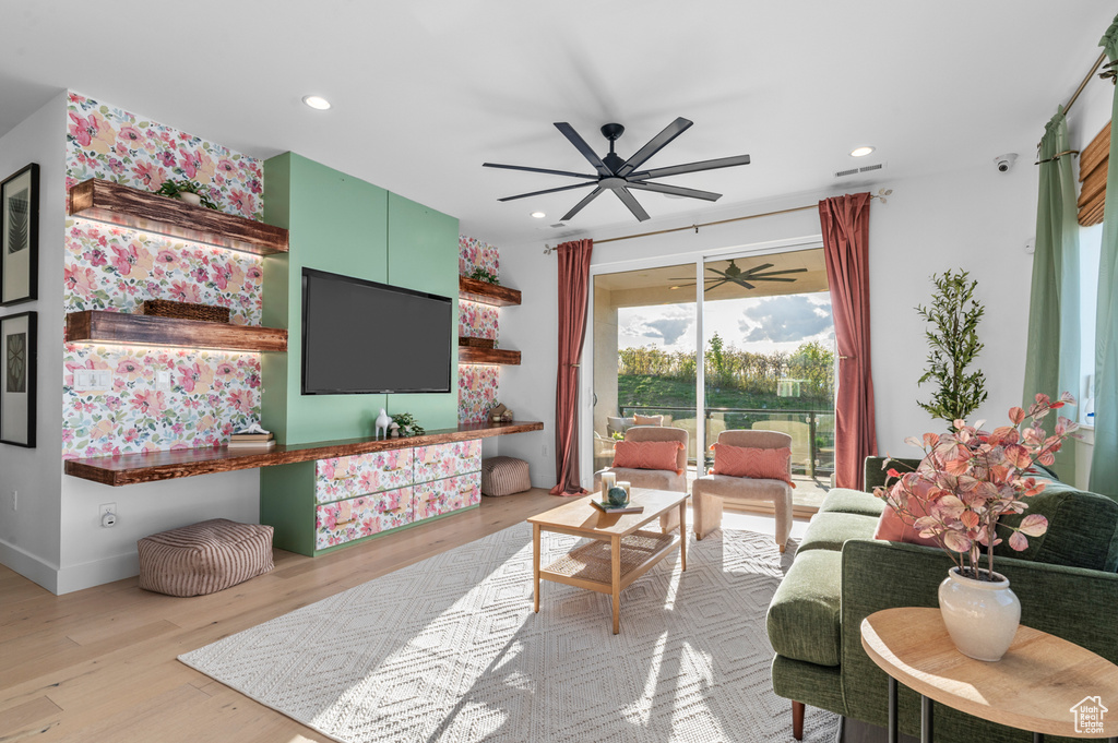 Living room with ceiling fan, wood finished floors, and recessed lighting