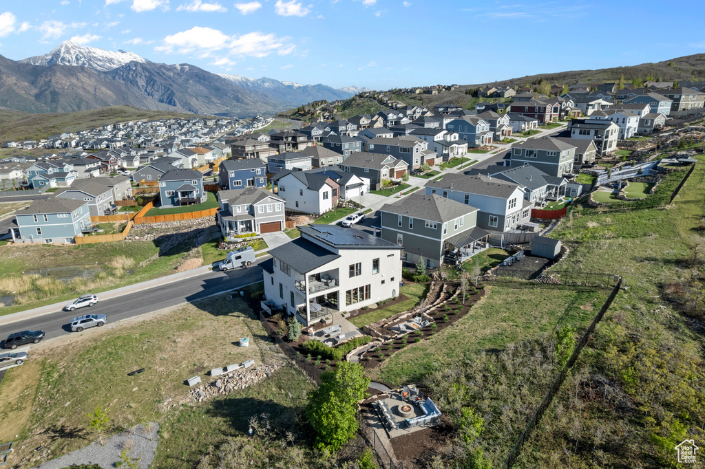 Aerial perspective of suburban area with a mountainous background