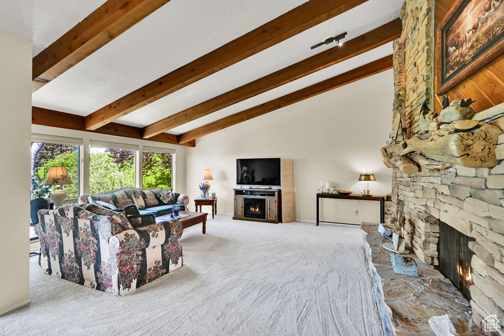 Carpeted living room featuring a fireplace