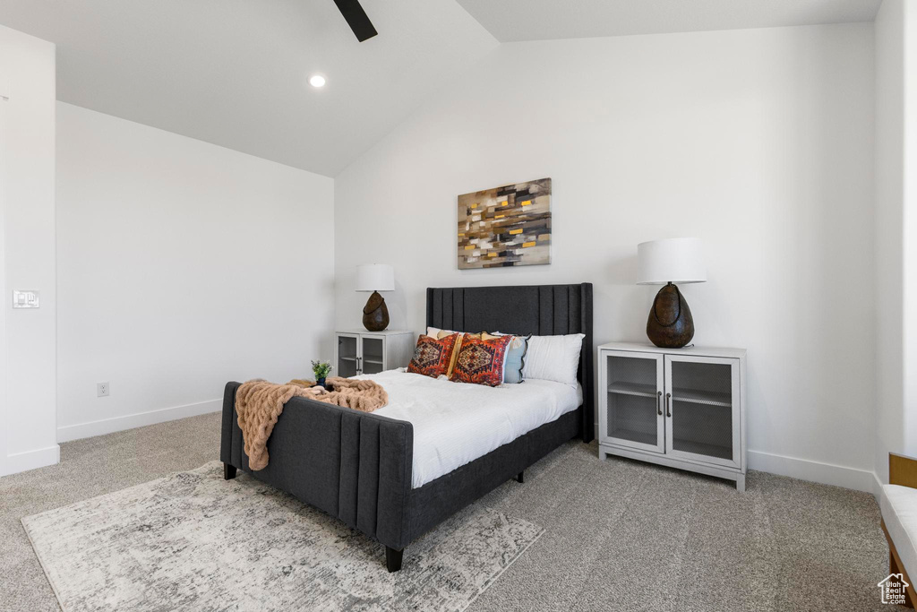 Bedroom with vaulted ceiling, carpet flooring, baseboards, ceiling fan, and recessed lighting