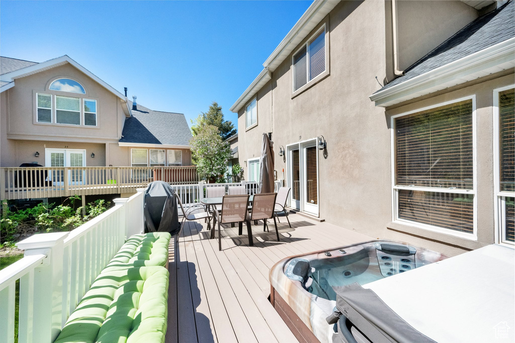 Wooden deck featuring outdoor dining space
