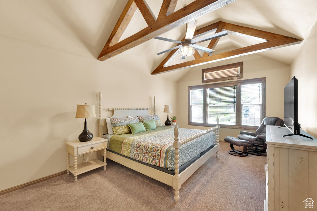 Carpeted bedroom featuring a ceiling fan and baseboards