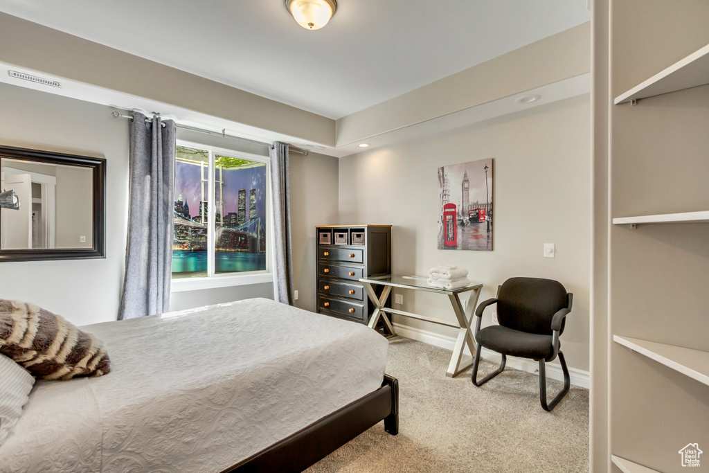 Carpeted bedroom with baseboards