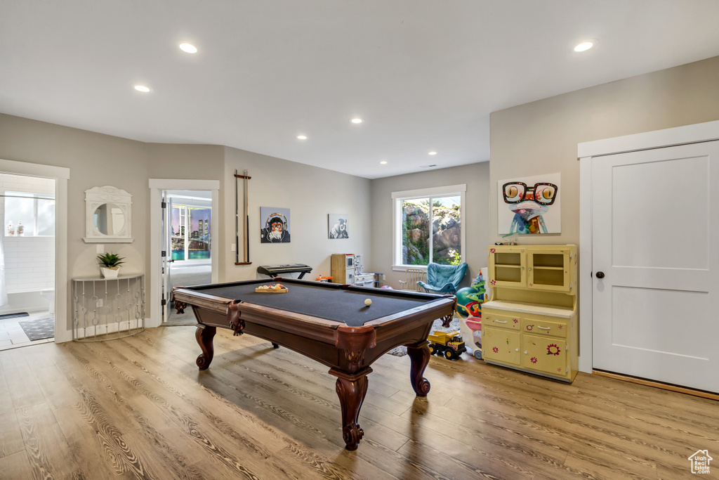 Game room with light wood-style floors, pool table, and recessed lighting