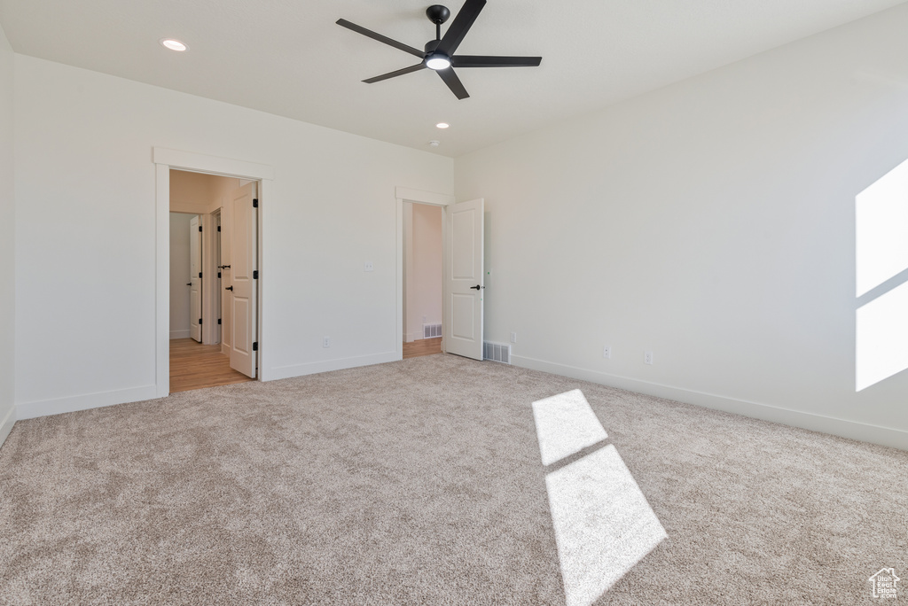 Unfurnished bedroom with carpet flooring, baseboards, recessed lighting, and a ceiling fan