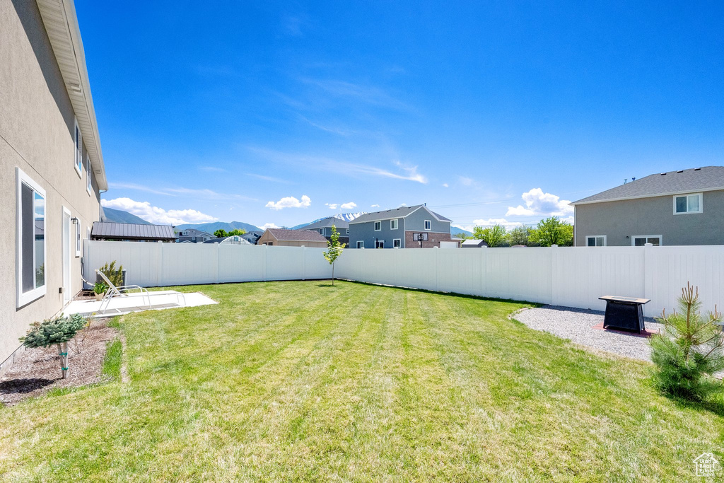 View of yard featuring a patio area and a residential view