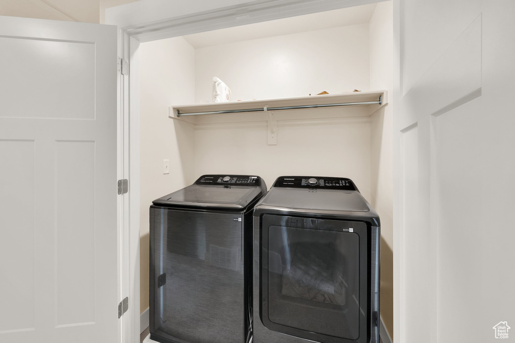 Washroom featuring independent washer and dryer