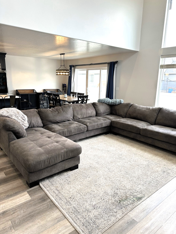 Living area with wood finished floors and plenty of natural light