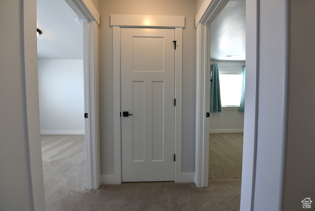 Hall with carpet flooring
