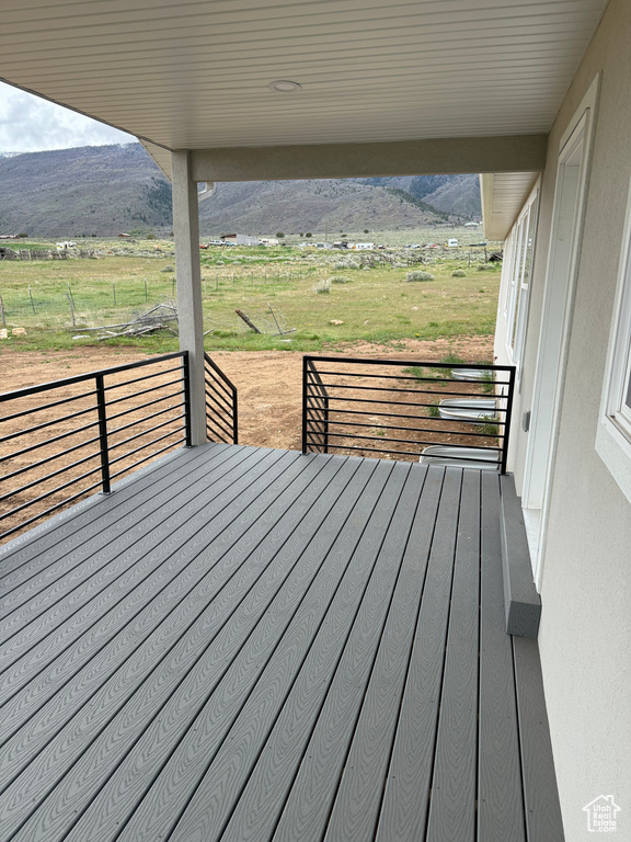 Deck featuring a mountain view and a view of rural / pastoral area
