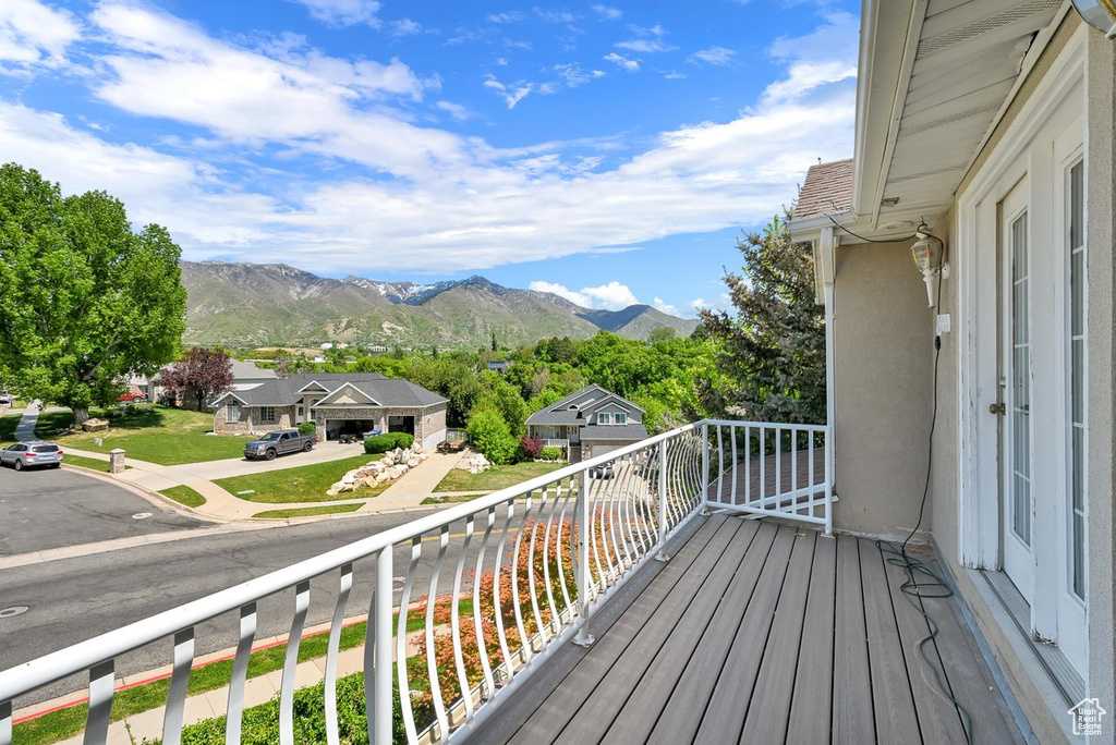 Balcony featuring a mountain view and a residential view