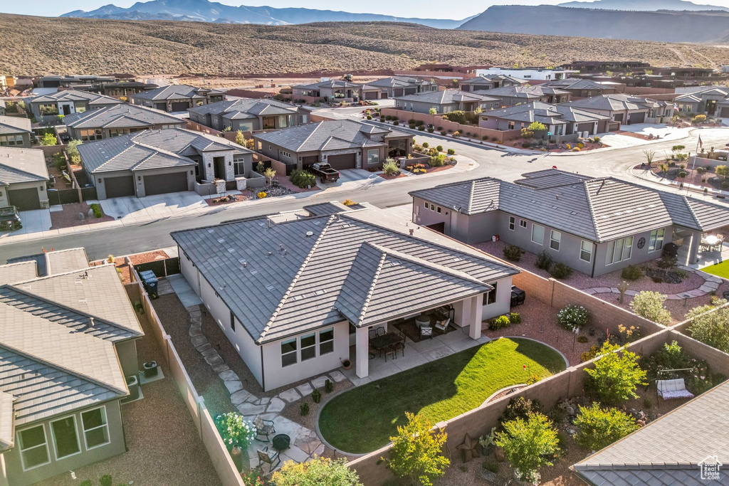 Aerial view of residential area with a mountainous background