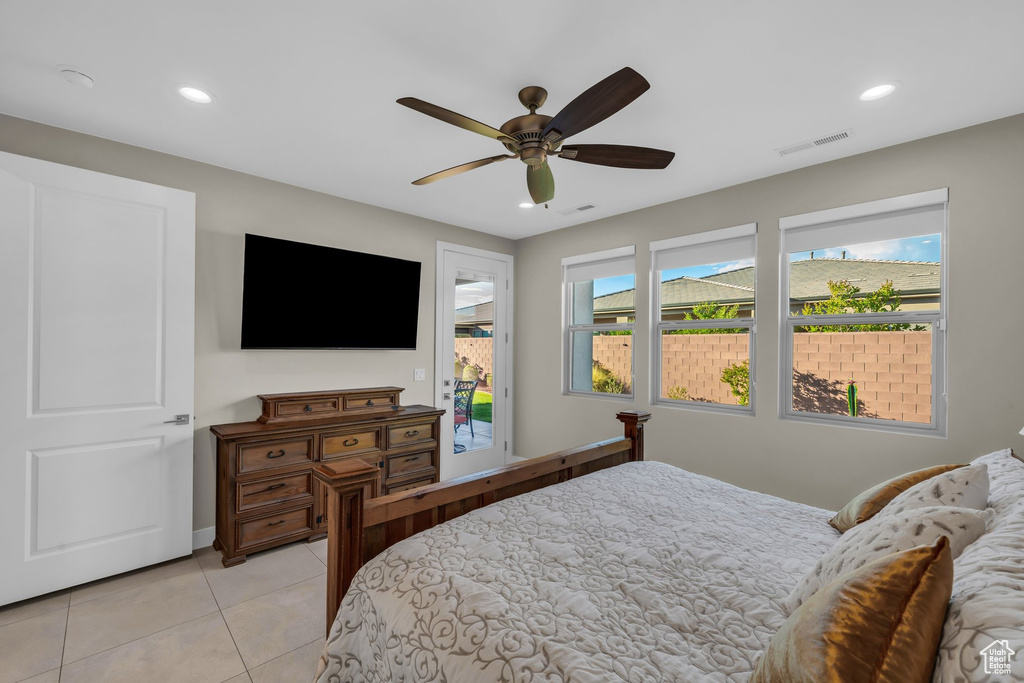 Bedroom with access to outside, light tile patterned floors, recessed lighting, a ceiling fan, and baseboards