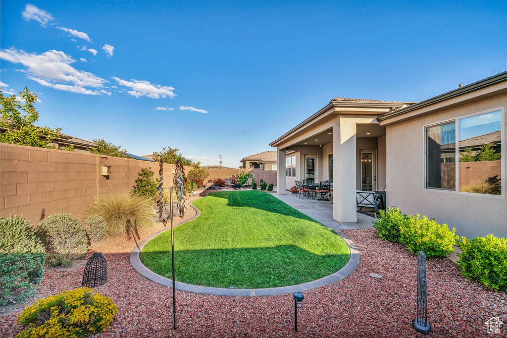 View of yard with a patio area