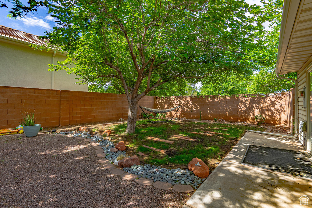 Fenced backyard featuring a patio area