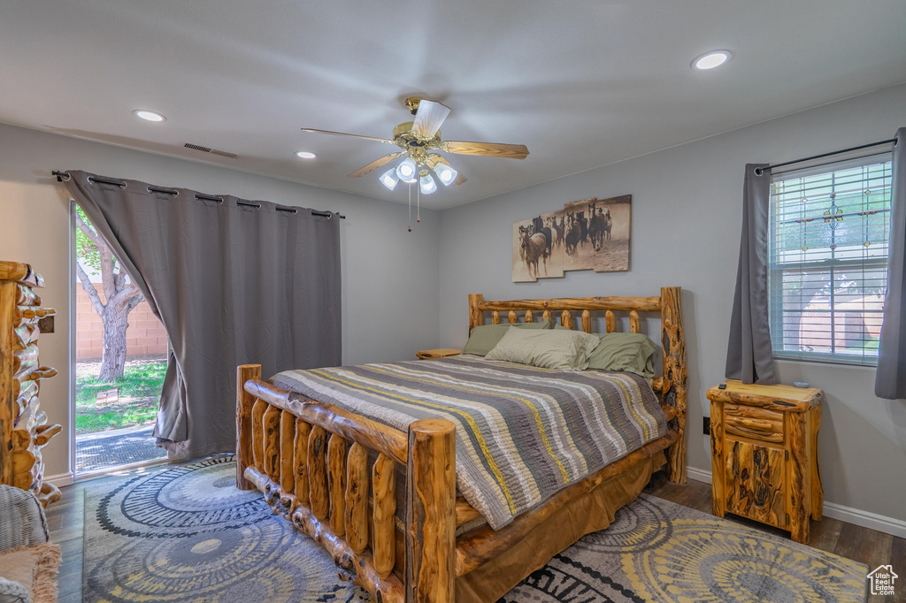 Bedroom with wood finished floors, access to exterior, recessed lighting, baseboards, and a ceiling fan