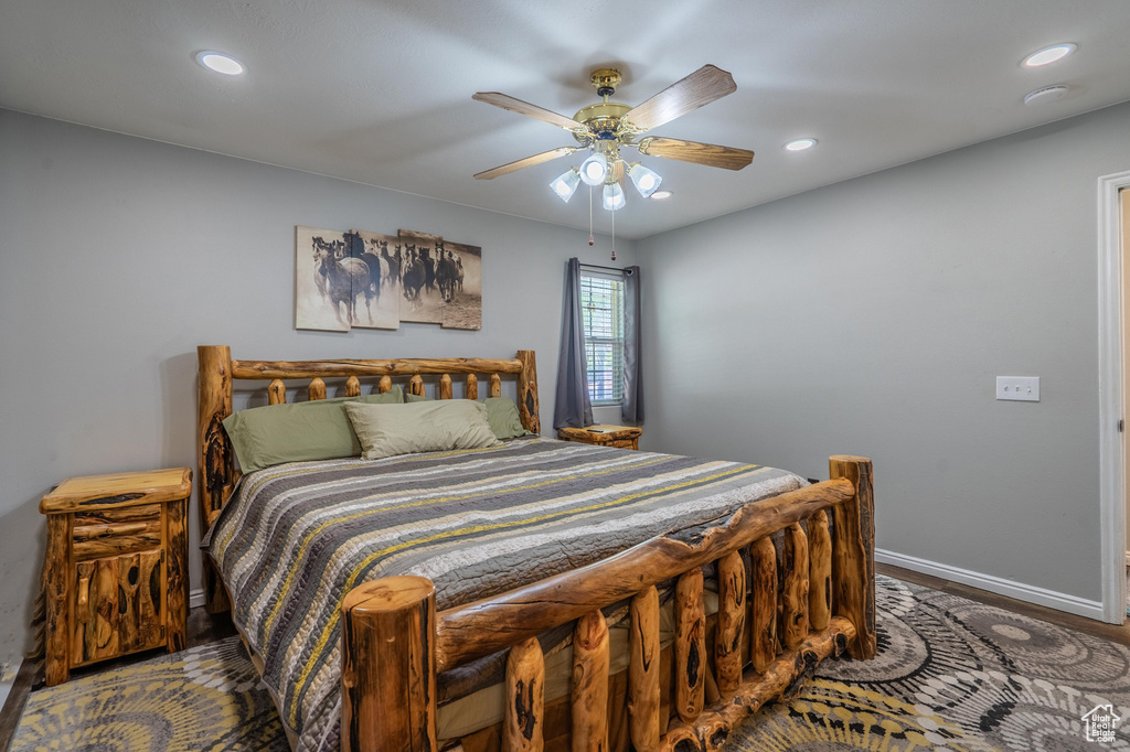 Bedroom with baseboards, recessed lighting, ceiling fan, and wood finished floors