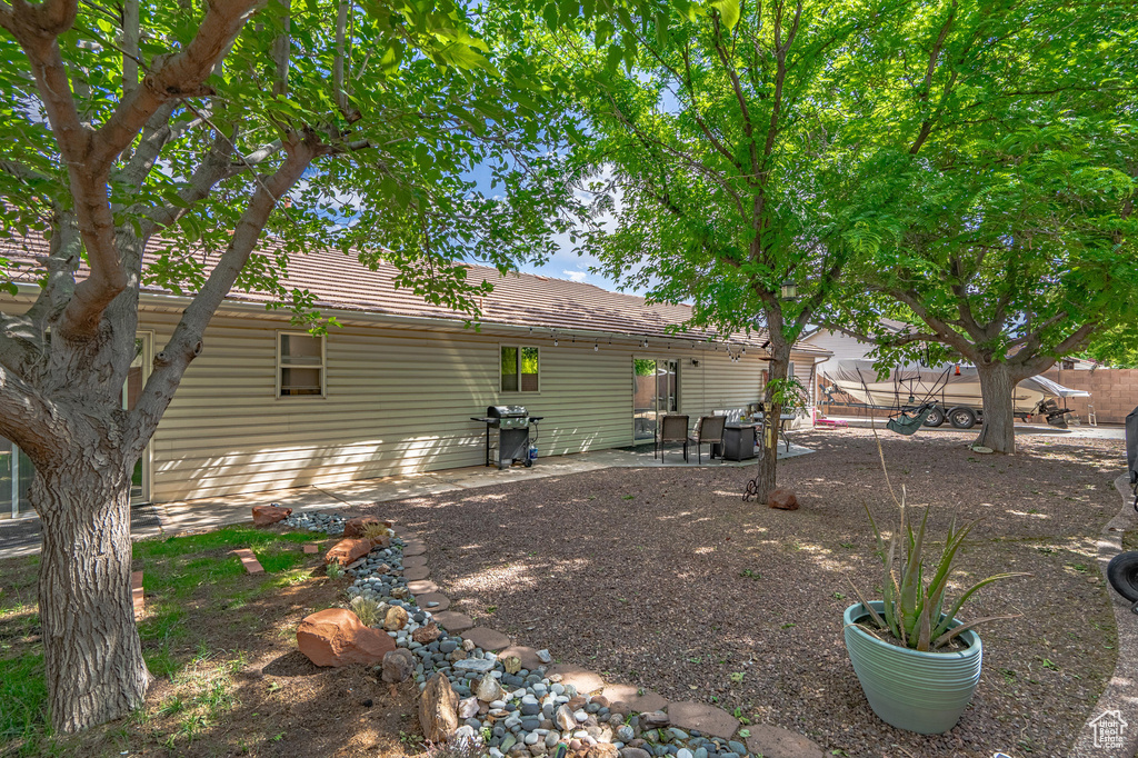 Rear view of house featuring a patio