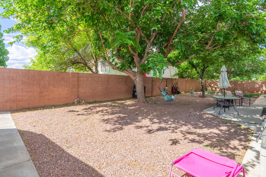 Fenced backyard with a patio area