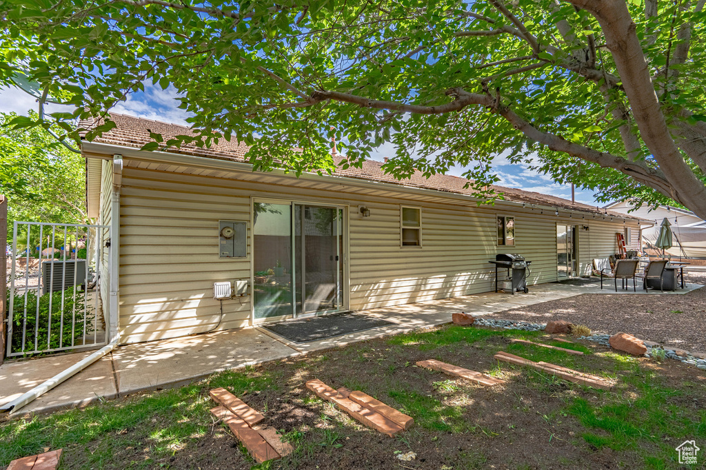Rear view of house with a patio