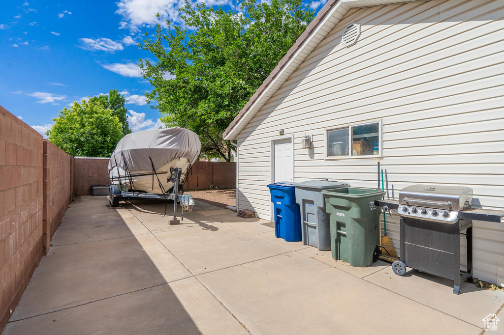 View of patio / terrace with area for grilling and a fenced backyard