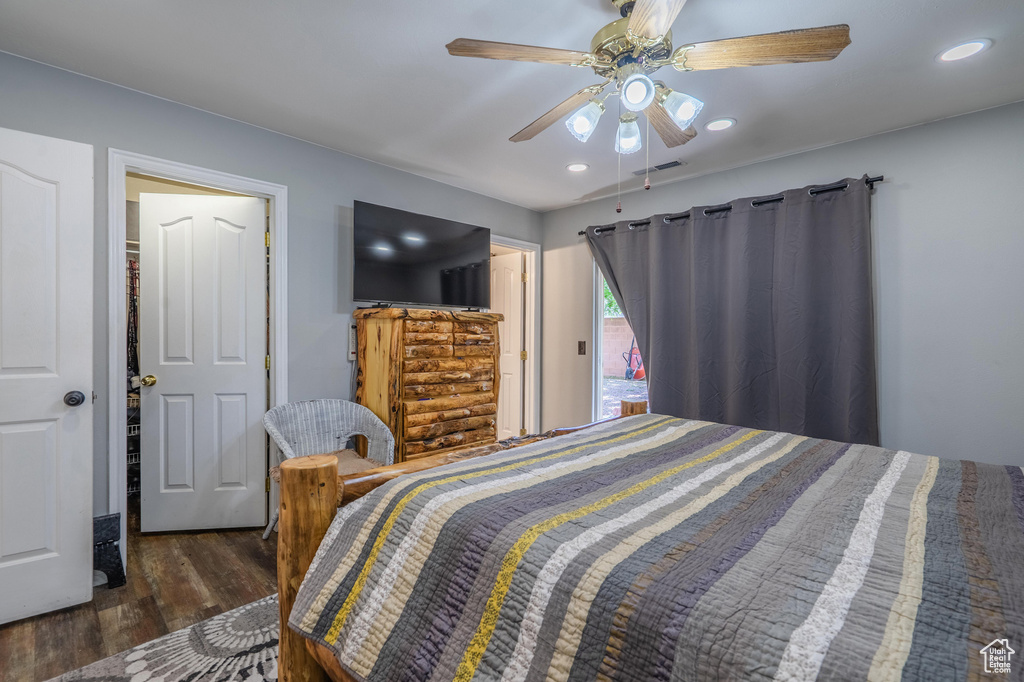 Bedroom with wood finished floors, ceiling fan, and recessed lighting