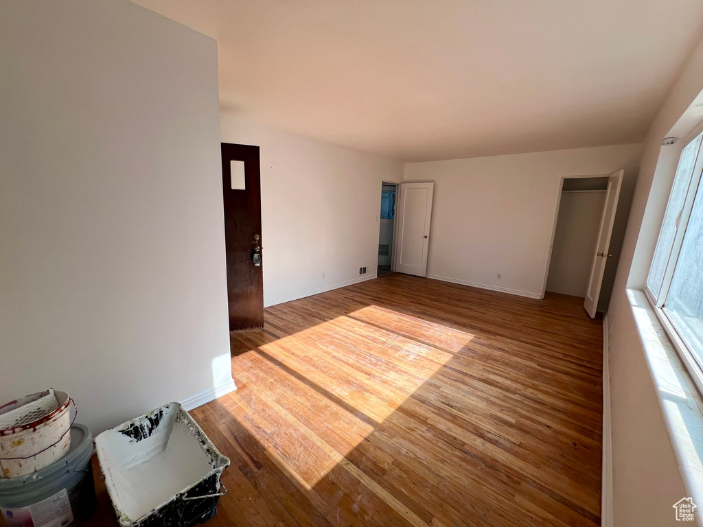 Spare room with light wood-style flooring and baseboards