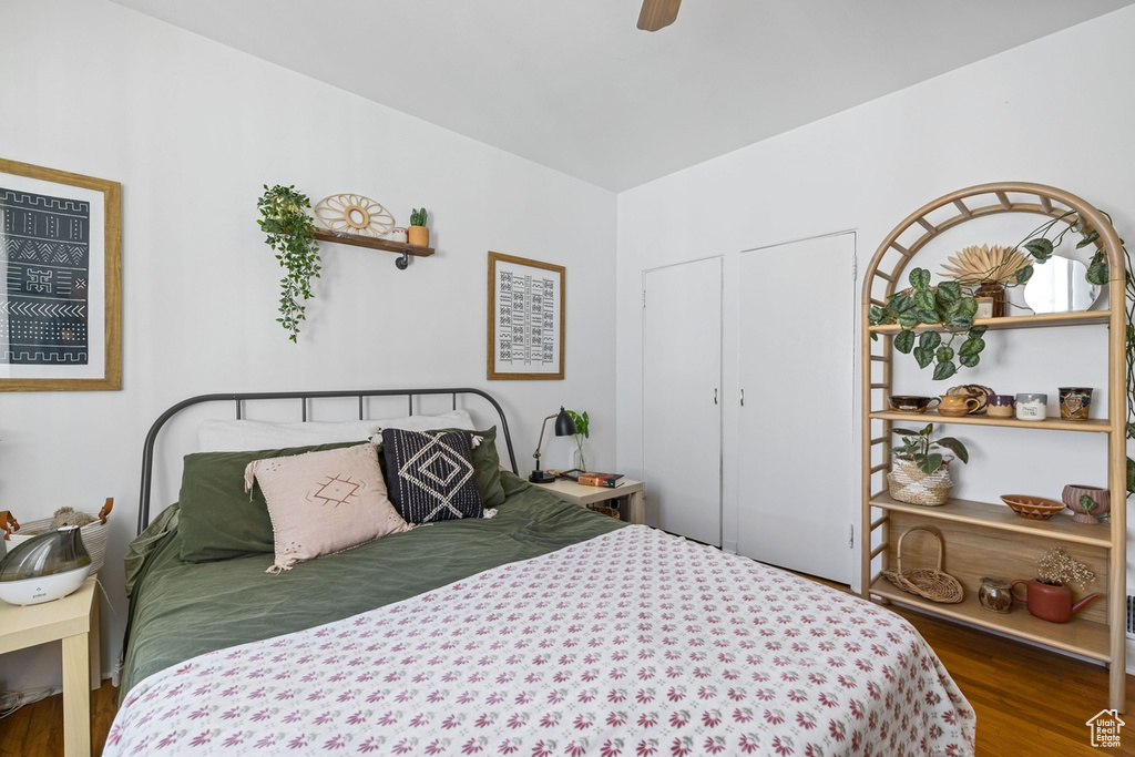 Bedroom featuring wood finished floors and a ceiling fan