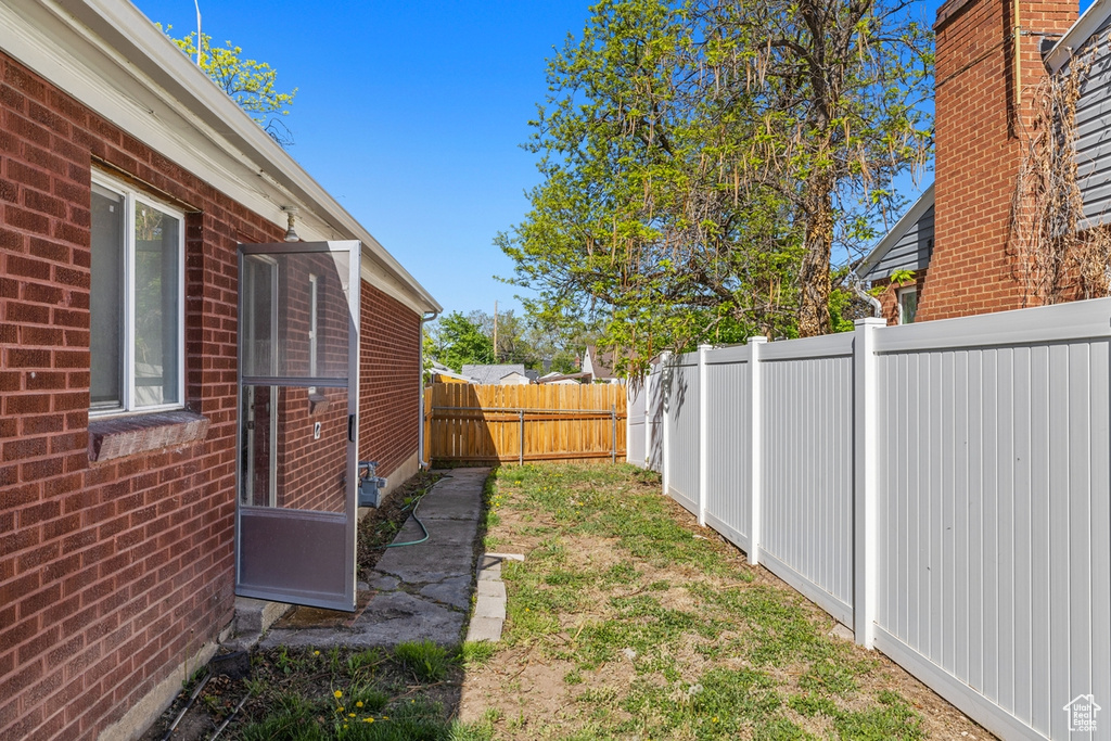 View of fenced backyard