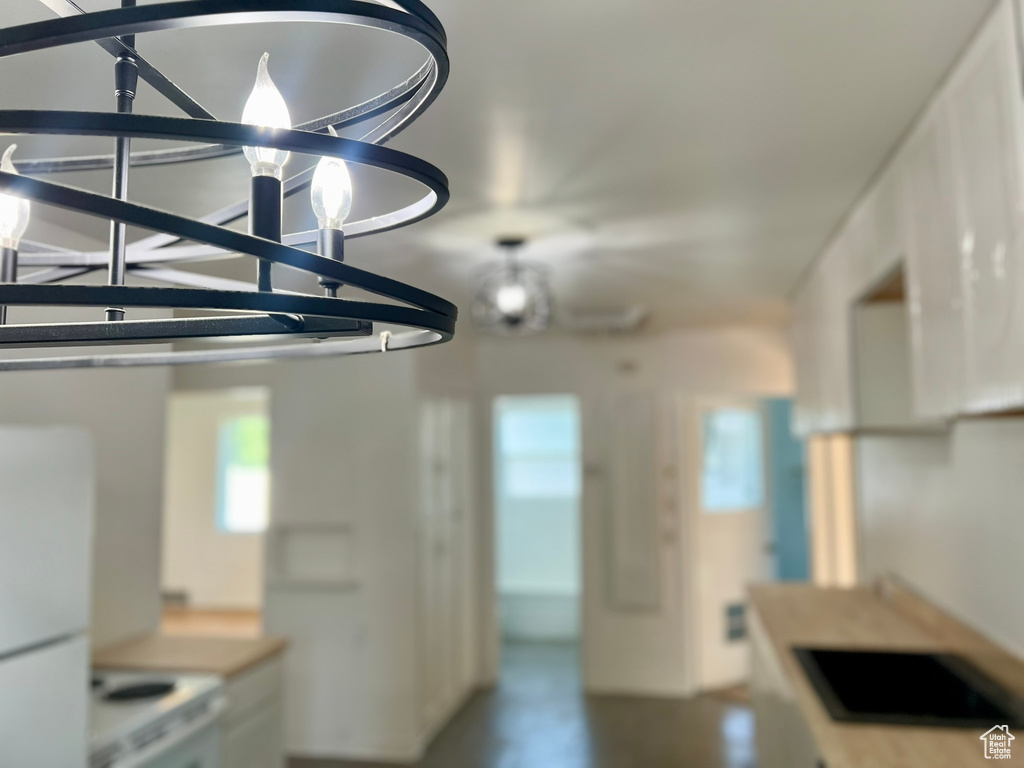 Kitchen with stove and freestanding refrigerator