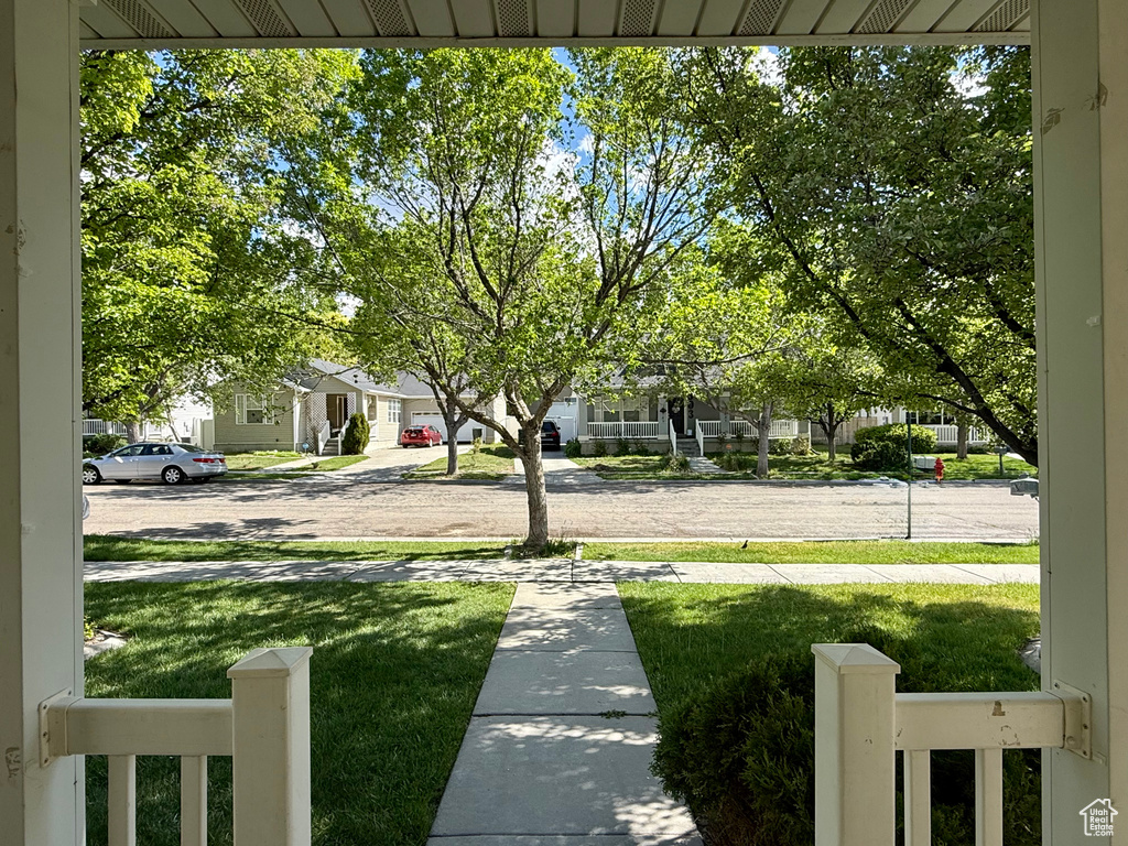 View of grassy yard with a residential view