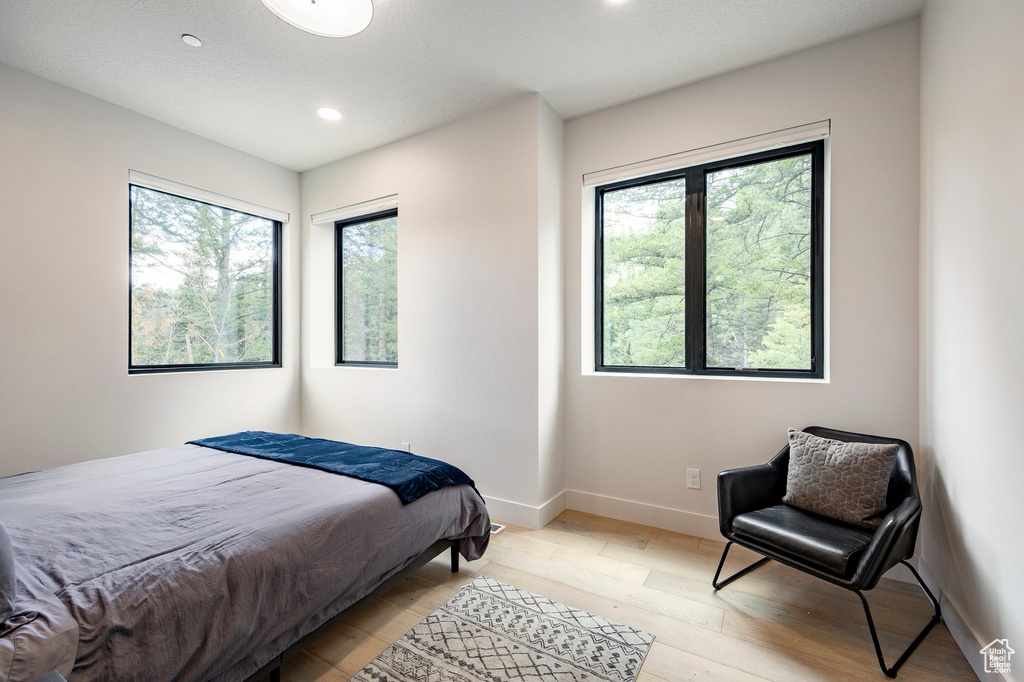Bedroom featuring recessed lighting, light wood-style flooring, and baseboards