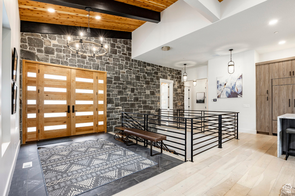 Welcome area with beam ceiling and recessed lighting