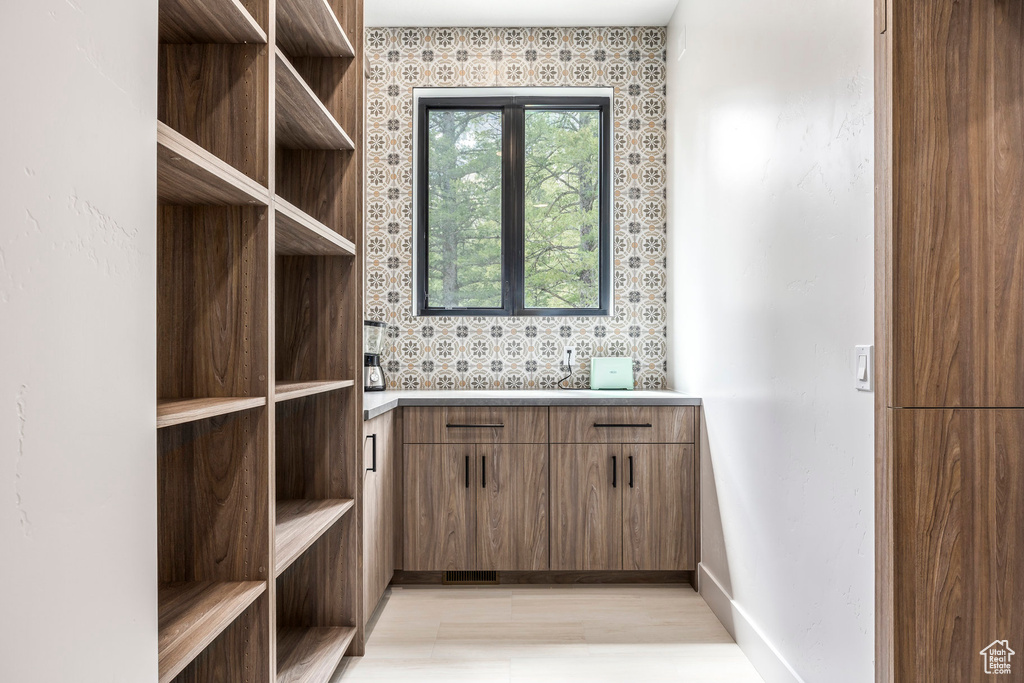 Bathroom featuring baseboards and vanity