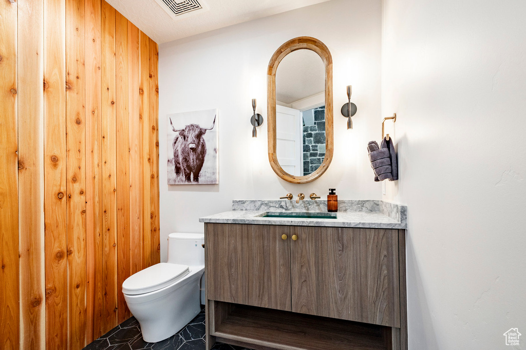 Bathroom featuring toilet and vanity