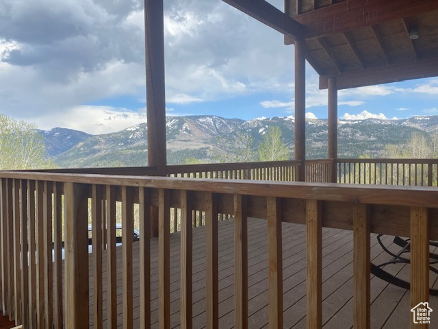 Wooden deck featuring a mountain view