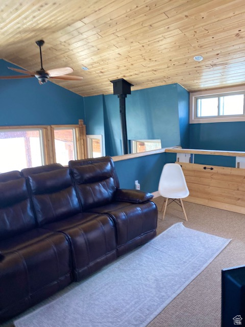 Living room with wooden ceiling, ceiling fan, carpet, and lofted ceiling