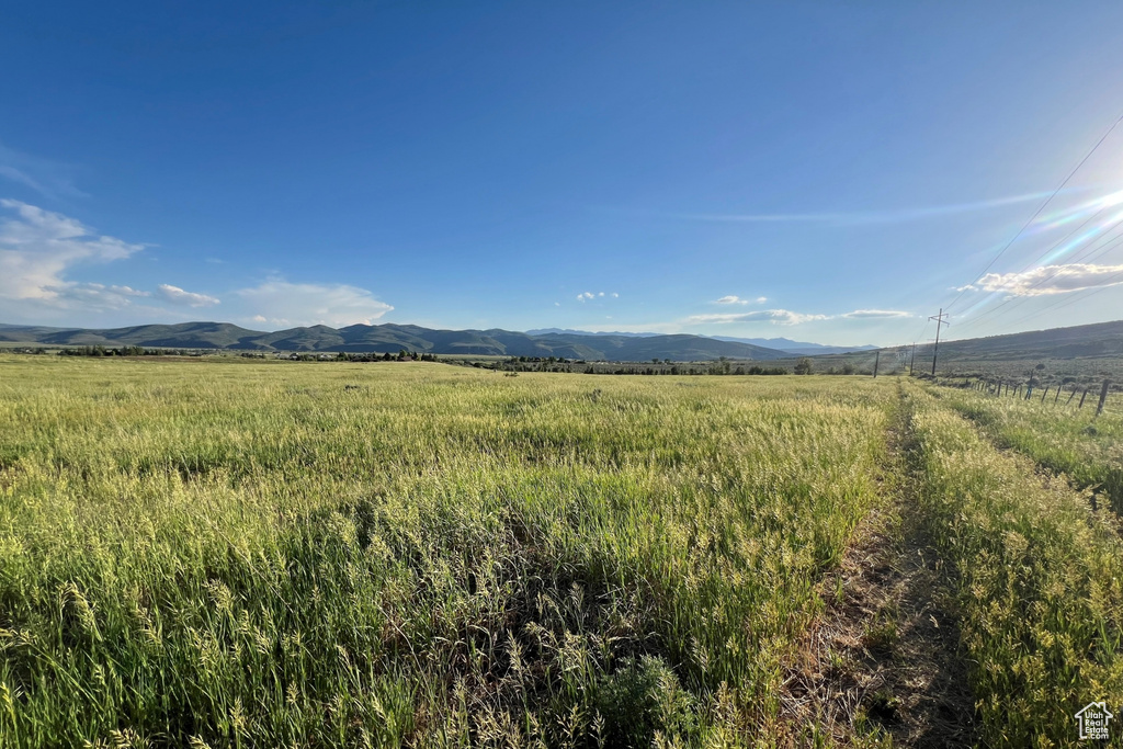 View of mountain backdrop with rural landscape