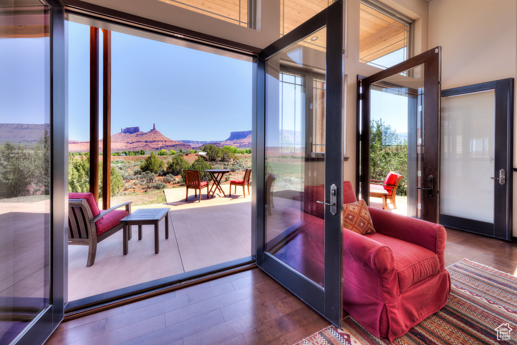 Doorway to outside with french doors, a mountain view, and wood finished floors