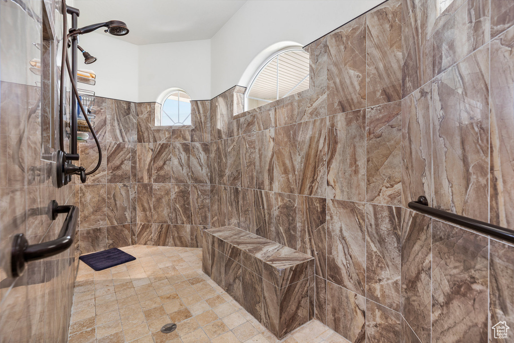 Full bathroom featuring tiled shower