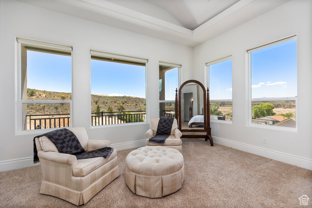 Sitting room with carpet flooring and baseboards