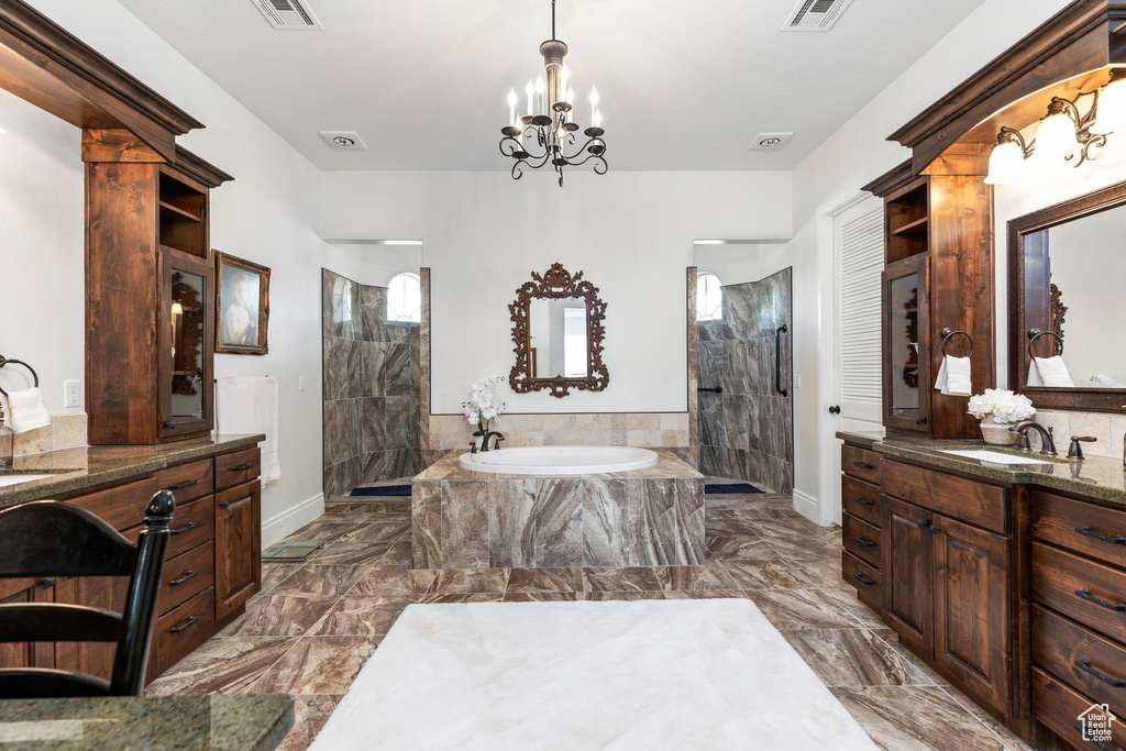 Full bathroom with a bath, a walk in shower, and marble finish flooring
